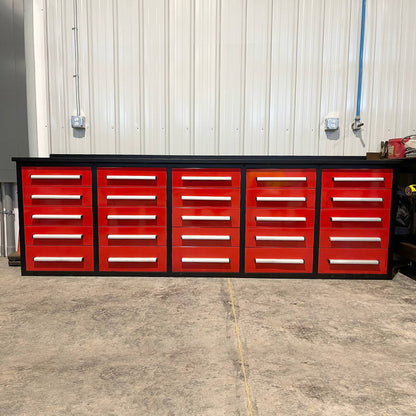Red tool cabinet with multiple drawers in a workshop setting#color_red